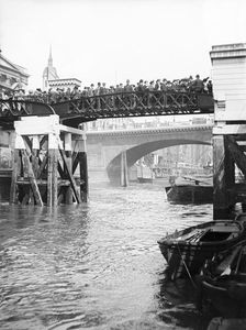 Passengers for the river bus service on the footbridge to London Bridge Pier, London, c1905