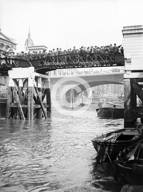 Passengers for the river bus service on the footbridge to London Bridge Pier, London, c1905. Artist: Unknown