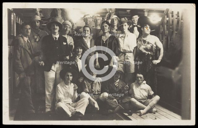Passengers on RMS Armadale Castle, some in drag, pose for a group portrait, 1933. Creator: Unknown.