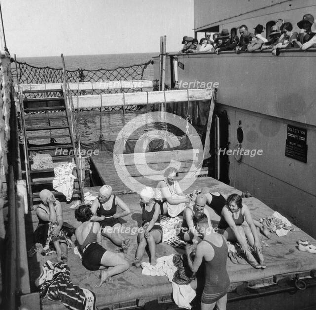 Passengers sunbathing on a Cunard Line cruise to the West Indies, January-March 1931. Artist: Unknown