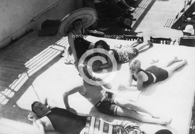 Passengers sunbathing on board a cruise ship, c1920s-c1930s(?). Artist: Unknown