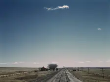Passing a section house along the Atchison, Topeka, and Santa Fe railroad, New Mexico, 1943. Creator: Jack Delano