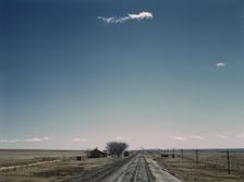 Passing a section house along the Atchison, Topeka, and Santa Fe railroad, New Mexico, 1943. Creator: Jack Delano