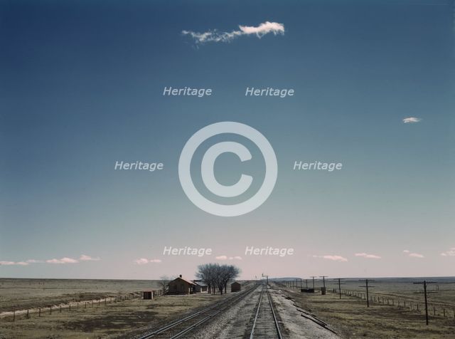 Passing a section house along the Atchison, Topeka, and Santa Fe railroad, New Mexico, 1943. Creator: Jack Delano.