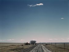 Passing a section house along the Atchison, Topeka, and Santa Fe railroad, New Mexico, 1943. Creator: Jack Delano