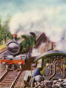 Passing at Speed. An unusual view from the tender of a goods engine 1935-36. Creator: Unknown