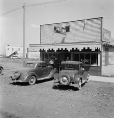 Pastime Cafe on main street of small potato town, Tulelake, Siskiyou County, California, 1939. Creator: Dorothea Lange