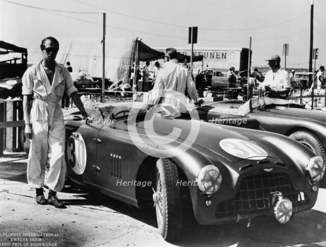 Peter Collins with an Aston Martin, Sebring, Florida, USA, 1950s. Artist: Unknown