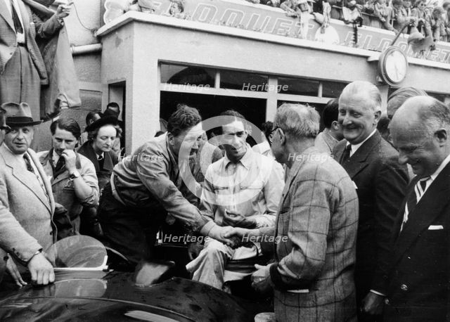 Peter Whitehead being congratulated on his victory with Peter Walker of the Le Mans 24 hours, 1951. Artist: Unknown