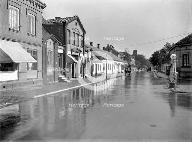 Petrol pump in a built-up area, Landskrona, Sweden, 1930. Creator: Unknown.