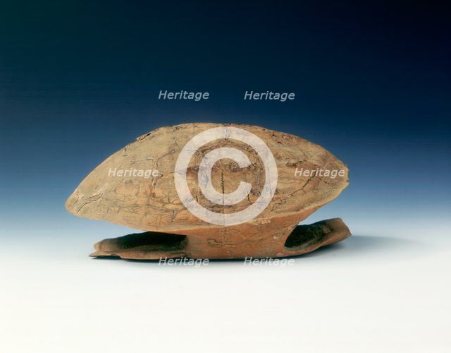 Petrified tortoise shell with oracle bone inscriptions, possibly Shang Dynasty, China, c1400 BC. Artist: Unknown