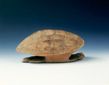 Petrified tortoise shell with oracle bone inscriptions, possibly Shang Dynasty, China, c1400 BC