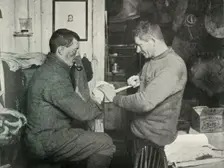Petty Officer Evans Binding Up Dr. Atkinson's Hand 5 July 1911, (1913). Artist: Herbert Ponting