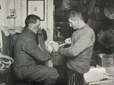 Petty Officer Evans Binding Up Dr. Atkinson's Hand 5 July 1911, (1913). Artist: Herbert Ponting