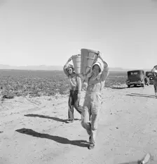 Pea pickers coming in to the weigh master, Sinclair Ranch, near Calipatria, California, 1939. Creator: Dorothea Lange