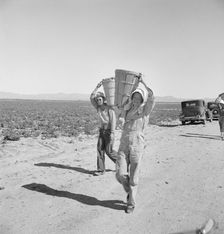 Pea pickers coming in to the weigh master, Sinclair Ranch, near Calipatria, California, 1939. Creator: Dorothea Lange