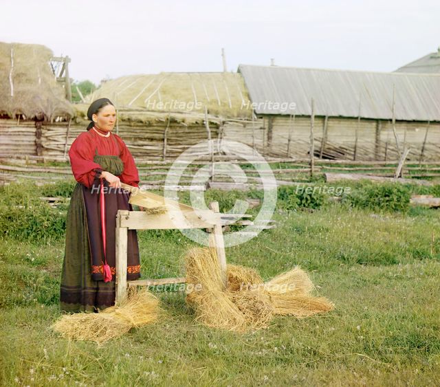 Peasant woman breaking flax;Perm Province, 1910. Creator: Sergey Mikhaylovich Prokudin-Gorsky.