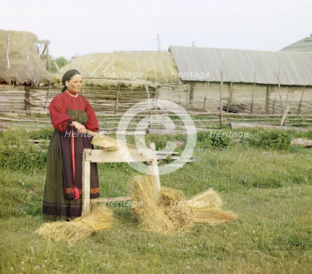 Peasant woman breaking flax;Perm Province, 1910. Creator: Sergey Mikhaylovich Prokudin-Gorsky.