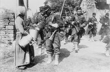 Peasant giving drink to French soldiers, between c1914 and c1915. Creator: Bain News Service