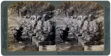 Peasant praying before a row of statues of the God of Light, Daiya river, Nikko, Japan, 1904.Artist: Underwood & Underwood