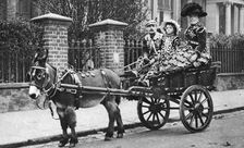 Pearly family in their donkey-drawn moke London, 1926-1927. Artist: McLeish