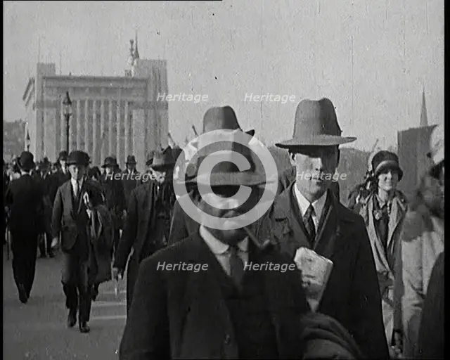 Pedestrians And Commuters Crossing London Bridge, 1920s. Creator: British Pathe Ltd.