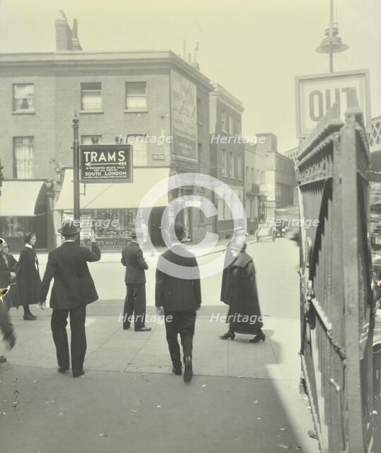 Pedestrians and tram sign outside Waterloo Station, Lambeth, London, 1929. Artist: Unknown.