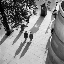 Pedestrians on the Victoria Embankment, London, seen from Waterloo Bridge. Artist: SW Rawlings