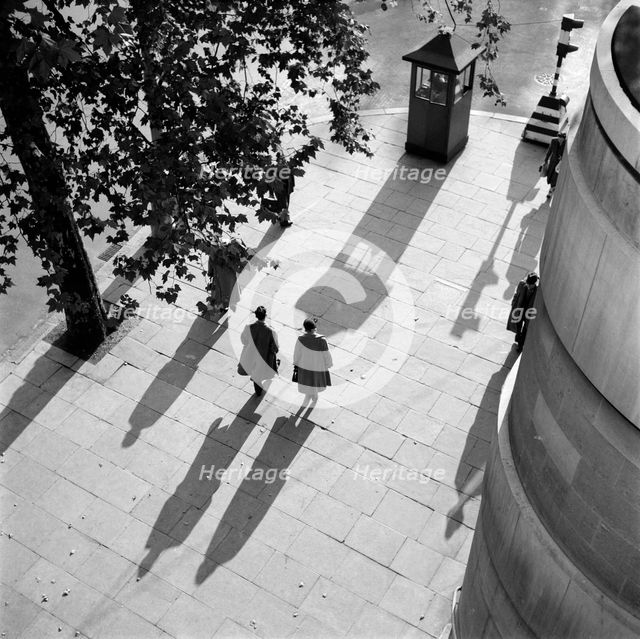 Pedestrians on the Victoria Embankment, London, seen from Waterloo Bridge. Artist: SW Rawlings
