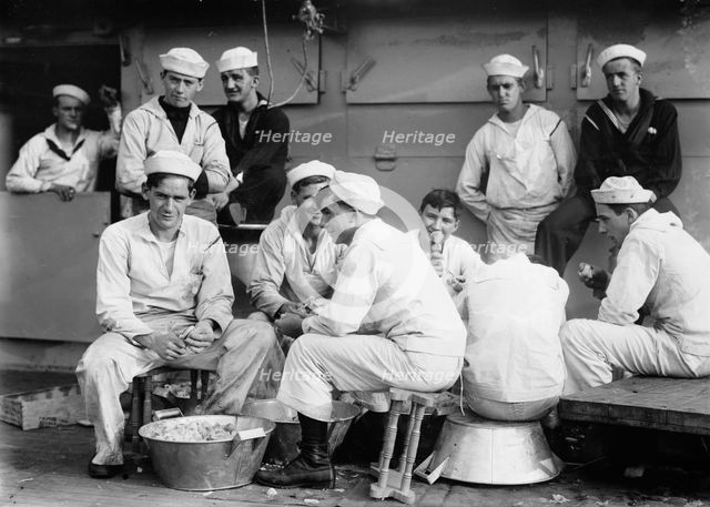 Peeling potatoes on USS Arkansas, between c1910 and c1915. Creator: Bain News Service.