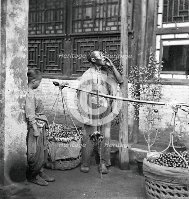Peking, Pechili province, China: a travelling fruit-seller, 1869. Creator: John Thomson.