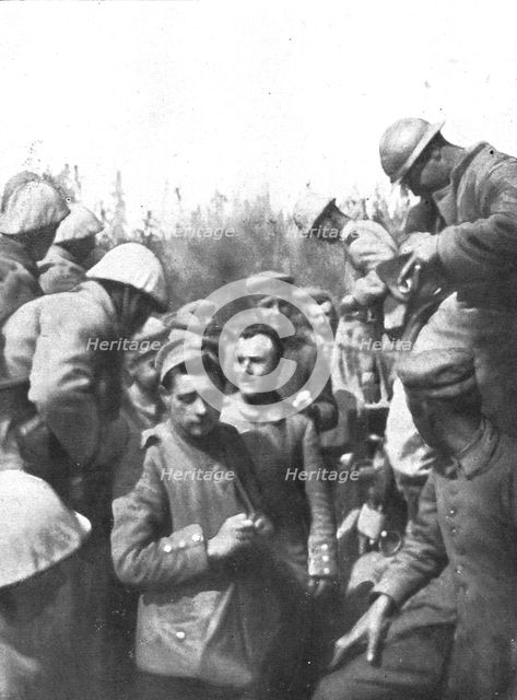 'Pendant l'action; Les premiers prisonniers du premier jour: de tres jeunes gens', 1916 (1924) Creator: Unknown.