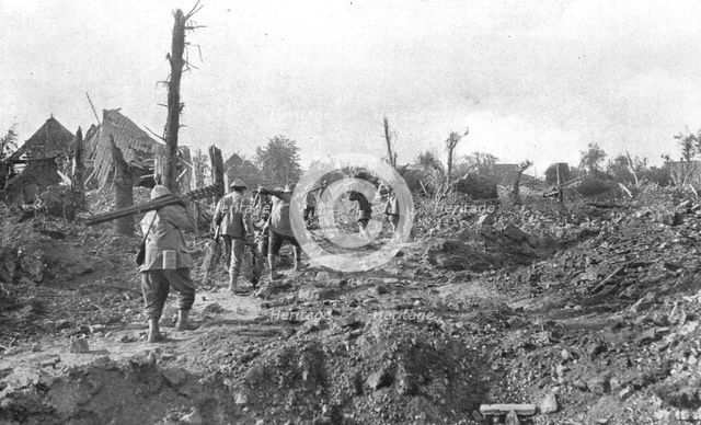 'Pendant l'action; Pour assurer la securite du terrain repris: transport a travers..., 1916 (1924) Creator: Unknown.