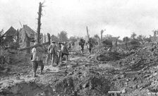 Pendant l'action; Pour assurer la securite du terrain repris: transport a travers..., 1916 (1924) Creator: Unknown