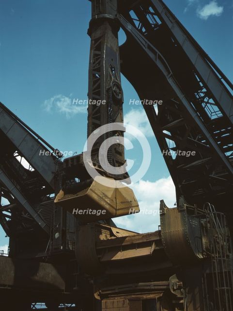 Pennsylvania R.R. ore docks, a "Hulett" ore unloader in operation, Cleveland, Ohio, 1943. Creator: Jack Delano.