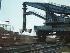 Pennsylvania R.R. ore docks, unloading ore from a lake freighter..., Cleveland, Ohio, 1943. Creator: Jack Delano