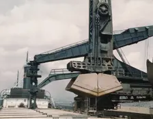 Pennsylvania R.R. ore docks, unloading ore from a lake freighter by means..., Cleveland, Ohio, 1943. Creator: Jack Delano