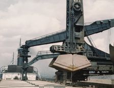 Pennsylvania R.R. ore docks, unloading ore from a lake freighter by means..., Cleveland, Ohio, 1943. Creator: Jack Delano