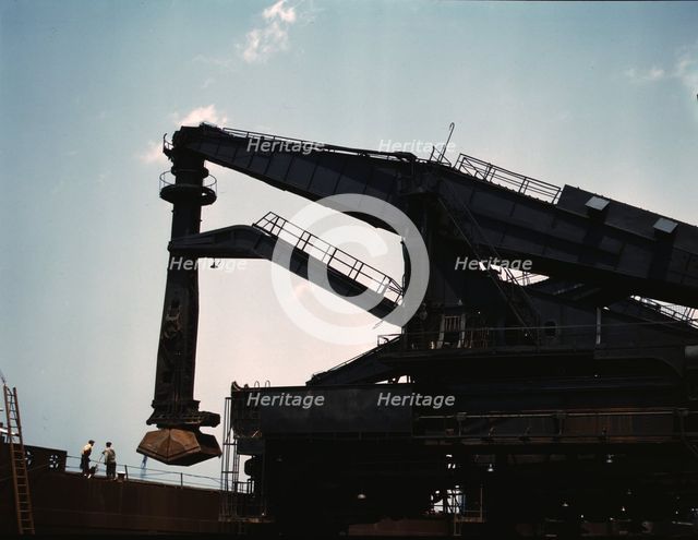 Pennsylvania R.R. ore docks, unloading iron ore from a lake freighter..., Cleveland, Ohio, 1943. Creator: Jack Delano.