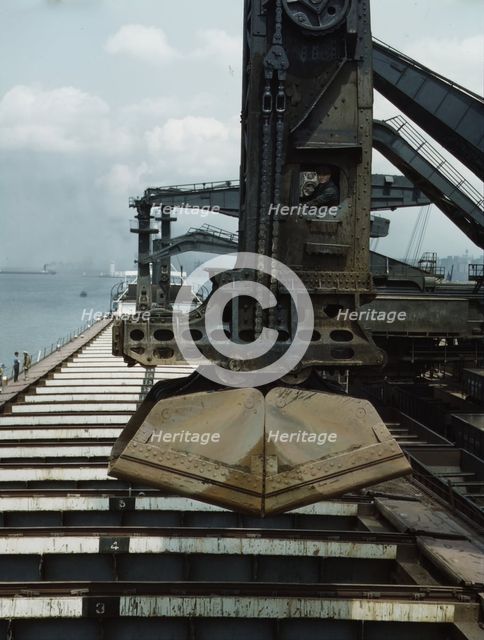Pennsylvania R.R. ore docks, unloading iron ore from a lake freighter..., Cleveland, Ohio, 1943. Creator: Jack Delano.