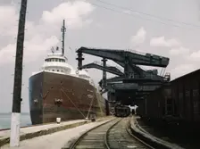 Pennsylvania R.R. ore docks, unloading iron ore from a lake freighter..., Cleveland, Ohio, 1943. Creator: Jack Delano