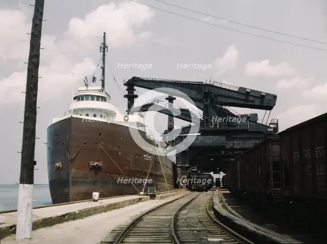 Pennsylvania R.R. ore docks, unloading iron ore from a lake freighter..., Cleveland, Ohio, 1943. Creator: Jack Delano.