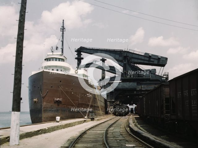 Pennsylvania R.R. ore docks, unloading iron ore from a lake freighter..., Cleveland, Ohio, 1943. Creator: Jack Delano.