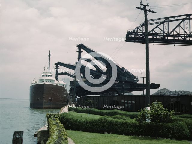 Pennsylvania R.R. [Railroad] ore docks, unloading iron ore from a lake..., Cleveland, Ohio, 1943. Creator: Jack Delano.