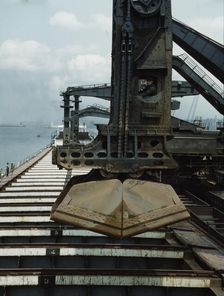 Pennsylvania R.R. ore docks, unloading iron ore from a lake freighter..., Cleveland, Ohio, 1943. Creator: Jack Delano