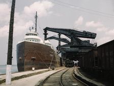 Pennsylvania R.R. ore docks, unloading iron ore from a lake freighter..., Cleveland, Ohio, 1943. Creator: Jack Delano