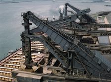 Pennsylvania R.R. ore docks, unloading iron ore from a lake freighter..., Cleveland, Ohio, 1943. Creator: Jack Delano
