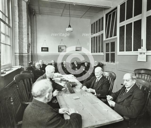 Pensioners playing cards in the Men's Day Room, Lambeth Home for Aged Poor, London, 1935. Artist: Unknown.