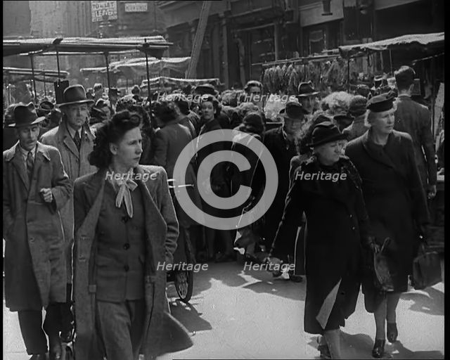 People Moving Along Crowded Streets, 1940. Creator: British Pathe Ltd.