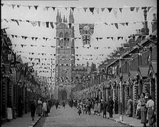 People Out the Front of Their Houses in a Street Decorated With Union Flag Bunting in Belfast, 1921. Creator: British Pathe Ltd